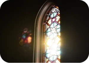 The sun shining through a stained glass window