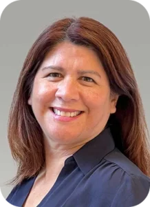 Smiling woman with shoulder length aburn hair