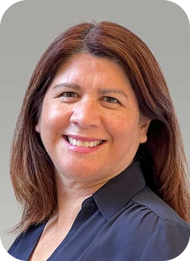 Smiling woman with shoulder length aburn hair