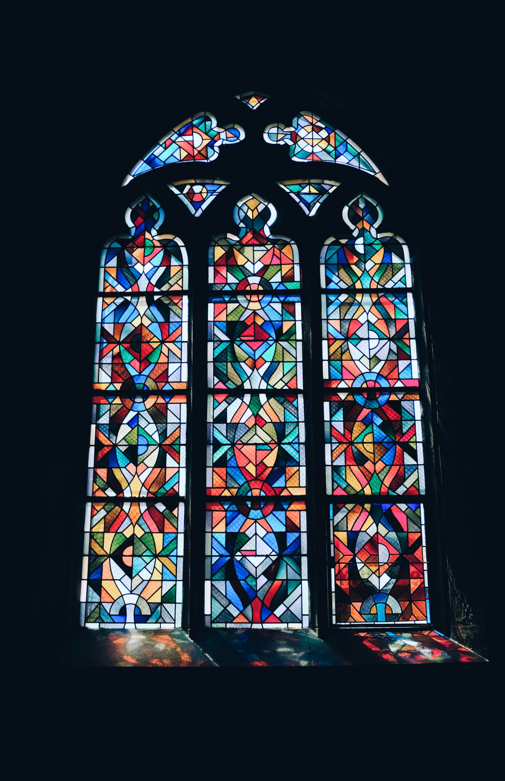 Non-denominational stained glass window with sunlight coming in